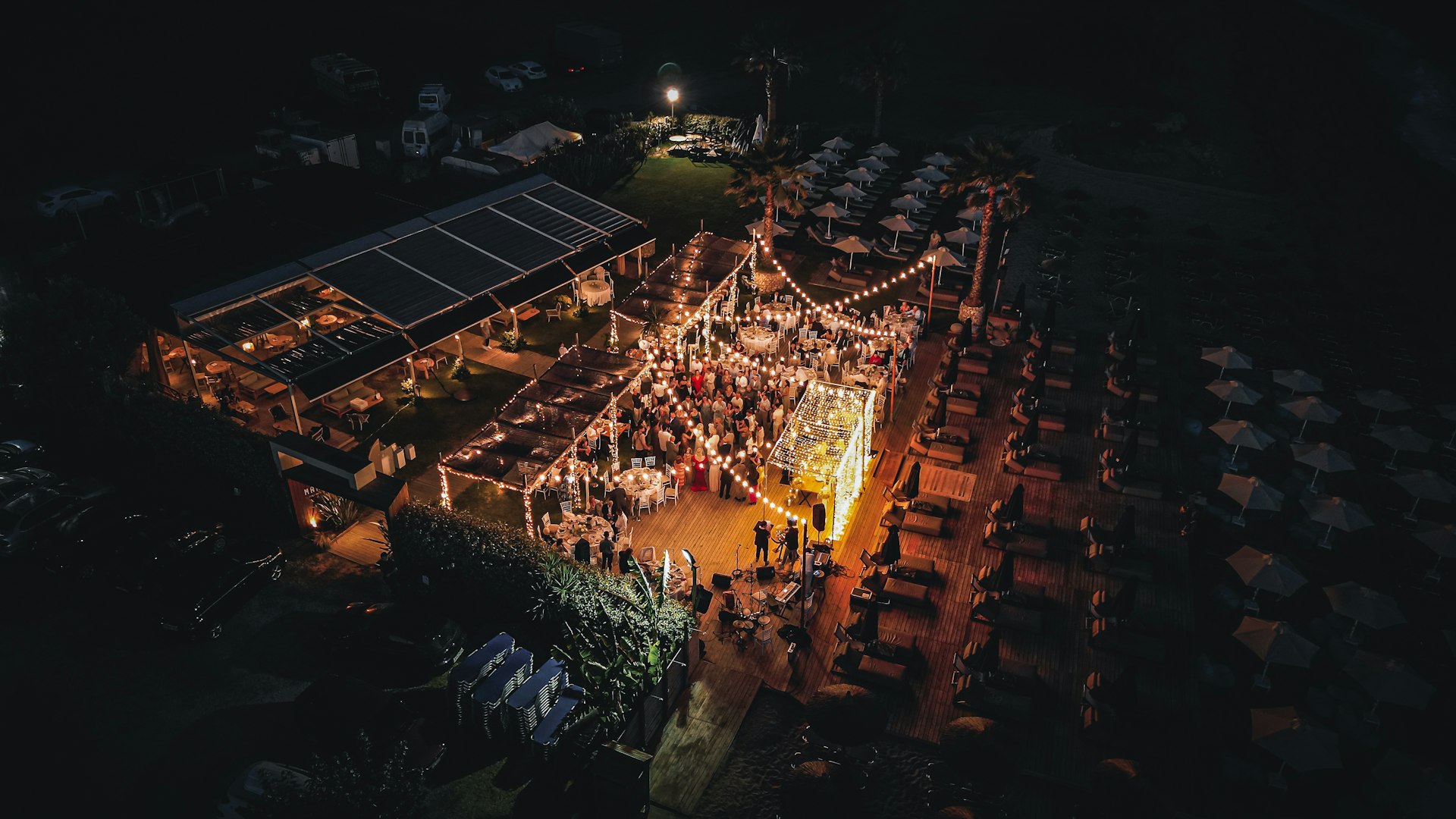 An aerial view of a wedding at night, drone shot